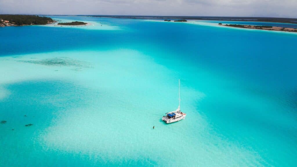 Drone photo of a boat on the Bacalar Lagoon